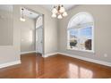 Inviting entryway with hardwood floors, arched windows, and a stylish chandelier at 3108 Byrom Rd., Myrtle Beach, SC 29579