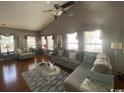 Bright living area with hardwood floors, lots of natural light and cozy decor at 471 Deerfield Links Dr., Surfside Beach, SC 29575