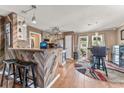 Bright kitchen with modern appliances, custom wood bar, and an adjacent dining area at 4916 Darby Ln., Myrtle Beach, SC 29579