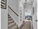 Hallway featuring a carpeted staircase leading up to the next level of the home at 5606 Whitebark Dr., Myrtle Beach, SC 29577