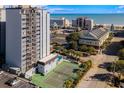 An aerial view shows a community pool and tennis court for residents enjoyment at 601 Mitchell Dr. # 801, Myrtle Beach, SC 29577