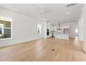 Spacious living room featuring hardwood floors, white walls and an open-concept layout at 738 Macon Alley, Myrtle Beach, SC 29588