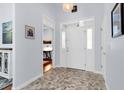 Bright foyer with neutral-colored tile flooring and white trim at 75 Prestwick Dr., Pawleys Island, SC 29585