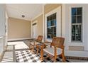 Relaxing front porch featuring rocking chairs, creating a welcoming outdoor space at 1127 East Isle Of Palms Ave., Myrtle Beach, SC 29579