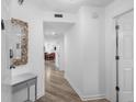 Bright hallway with wood-look floors leads to the dining area and bedroom at 145 S Dunes Dr. # 109, Pawleys Island, SC 29585