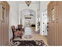 Inviting home entrance showcasing tile floors, decorative rug, chandelier and an open floor plan at 156 Henry Middleton Blvd., Myrtle Beach, SC 29588