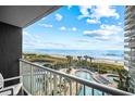 Enjoy breathtaking views of the beach, ocean, and resort pool from this private balcony at 161 Seawatch Dr. # 410, Myrtle Beach, SC 29572