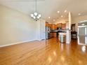Bright and spacious interior showcasing hardwood floors and open concept kitchen at 1612 Fairforest Ct., Conway, SC 29526