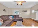 Spacious living room with hardwood floors, comfortable seating, and beachy decor at 1631 27Th Ave. N, North Myrtle Beach, SC 29582