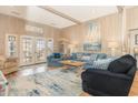 Cozy living room with coastal decor, comfortable seating, and access to the outdoor porch at 1644 South Waccamaw Dr., Murrells Inlet, SC 29576
