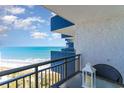 Relaxing balcony view overlooking the sandy beach and ocean, complete with a charming table setting at 2001 S Ocean Blvd. # 1505, Myrtle Beach, SC 29577