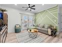 Stylish living room with modern decor, decorative wall, comfortable seating, and lots of light at 2013 Silvercrest Dr. # 30-F, Myrtle Beach, SC 29579