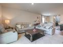 Spacious living room with neutral colors, plush seating, and a decorative coffee table at 228 Carolina Lakes Blvd., Myrtle Beach, SC 29588