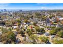 An aerial view shows the home's proximity to the beach, surrounded by lush greenery and neighborhood amenities at 2405 Douglas St., North Myrtle Beach, SC 29582