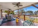 Inviting front porch with comfortable seating, ceiling fans, and string lights, perfect for relaxing outdoors at 2405 Douglas St., North Myrtle Beach, SC 29582