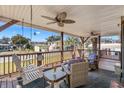 Relaxing front porch featuring a swing, comfortable seating, and charming decor for outdoor enjoyment at 2405 Douglas St., North Myrtle Beach, SC 29582
