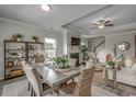 Elegant dining room featuring an open floor plan with a fireplace and stylish decor at 265 Mayflower Dr., Calabash, NC 28467