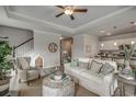 Bright living room with a white sofa, stylish decor, and an open floor plan at 265 Mayflower Dr., Calabash, NC 28467