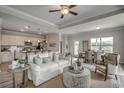 Cozy living room featuring a comfortable sofa, open floor plan, and a view of the dining area at 265 Mayflower Dr., Calabash, NC 28467