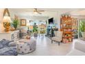 Bright living room with large windows, stylish furnishings, and modern decor at 276 Salt Marsh Circle # 4D, Pawleys Island, SC 29585
