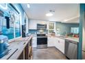 Bright kitchen featuring stainless steel appliances and plenty of counter space at 358 Salt Marsh Circle # 10-A, Pawleys Island, SC 29585