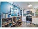 Updated kitchen with stainless steel appliances and custom shelving at 358 Salt Marsh Circle # 10-A, Pawleys Island, SC 29585