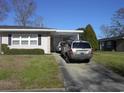 The exterior features a carport and driveway with space for parking, as well as neat landscaping at 3752 Tea Rose St. # 3752, Myrtle Beach, SC 29577