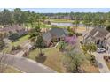 Beautiful home with golf course views, lush landscaping and serene lake backdrop at 4222 Congressional Dr., Myrtle Beach, SC 29579