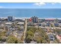 Overhead view of the condo amidst a vibrant residential area, near the ocean at 4500 S Ocean Blvd. # 9-B, North Myrtle Beach, SC 29582