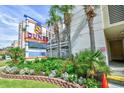 Captivating sign for Dunes Village Resort amidst vibrant landscaping, inviting relaxation and Gathering fun at 5300 N Ocean Blvd. # 708, Myrtle Beach, SC 29577