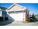 Detached garage with a white door and a well maintained yard at 676 Johnson Ave., Myrtle Beach, SC 29577