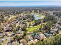 Expansive aerial view of the house, golf course, and community at 749 Club Circle, Pawleys Island, SC 29585