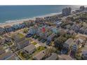 Beautiful ocean view of colorful coastal homes with easy beach access, perfect for a seaside getaway at 113B 15Th Ave. S, Surfside Beach, SC 29575