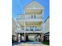 Charming beach house with spacious balconies and covered parking, ideal for coastal living and entertaining at 113B 15Th Ave. S, Surfside Beach, SC 29575