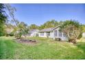 Spacious backyard featuring green grass and two homes in a shared yard at 1161 Ganton Way, Myrtle Beach, SC 29588