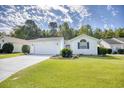 Charming single-story home featuring a two-car garage and well-manicured front lawn at 1161 Ganton Way, Myrtle Beach, SC 29588