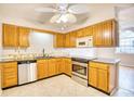 Traditional kitchen with oak cabinets, tile flooring, stainless steel appliances, and a granite countertop at 1161 Ganton Way, Myrtle Beach, SC 29588