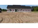 New construction showing the back of a charming single story home on a spacious lot at 1284 Highway 45, Loris, SC 29569