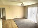 Bright living room featuring wood floors, neutral walls and a fan to keep you comfortable at 1356 Glenns Bay Rd. # 202L, Surfside Beach, SC 29575