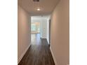 Inviting hallway with sleek wood flooring leading to bright living spaces and an outdoor view at 191 Glengrove Lane, Murrells Inlet, SC 29576