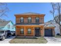 Charming two-story home with wood siding, a welcoming front porch, and an attached garage at 4237 Brook Dr., Murrells Inlet, SC 29576