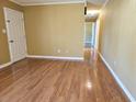 Spacious living room featuring wood floors and a view into the hallway at 4661 Redwood Dr., Myrtle Beach, SC 29588