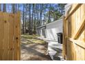 Fully fenced yard with a brick-lined pathway leading to a sliding glass door at 746 Gumbo Limbo Ln., Myrtle Beach, SC 29579