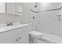 Stylish bathroom featuring a walk-in shower with white marble tile and updated fixtures at 746 Gumbo Limbo Ln., Myrtle Beach, SC 29579