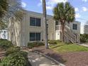Well-kept condo exterior with a staircase and attractive landscaping at 1 Norris Dr. # 249, Pawleys Island, SC 29585