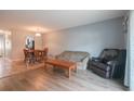Open living area with wood and tile flooring features a dining area and comfortable seating at 1025 Carolina Rd. # O4, Conway, SC 29526