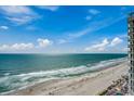 Stunning panoramic ocean view, with a sandy beach and the building's balconies at 107 S Ocean Blvd. # 1407, Myrtle Beach, SC 29577