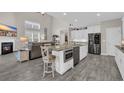 Open-concept kitchen boasting stainless steel appliances, granite countertops, and a spacious island with seating at 1109 Bonnet Dr., North Myrtle Beach, SC 29582