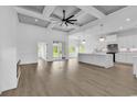 Expansive open layout with modern kitchen, a fireplace, and access to the outdoors at 144 Sago Palm Dr., Myrtle Beach, SC 29579