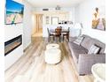 Cozy living room with open floor plan to the kitchen, dining area, and fireplace at 205 74Th Ave. N # 904, Myrtle Beach, SC 29572